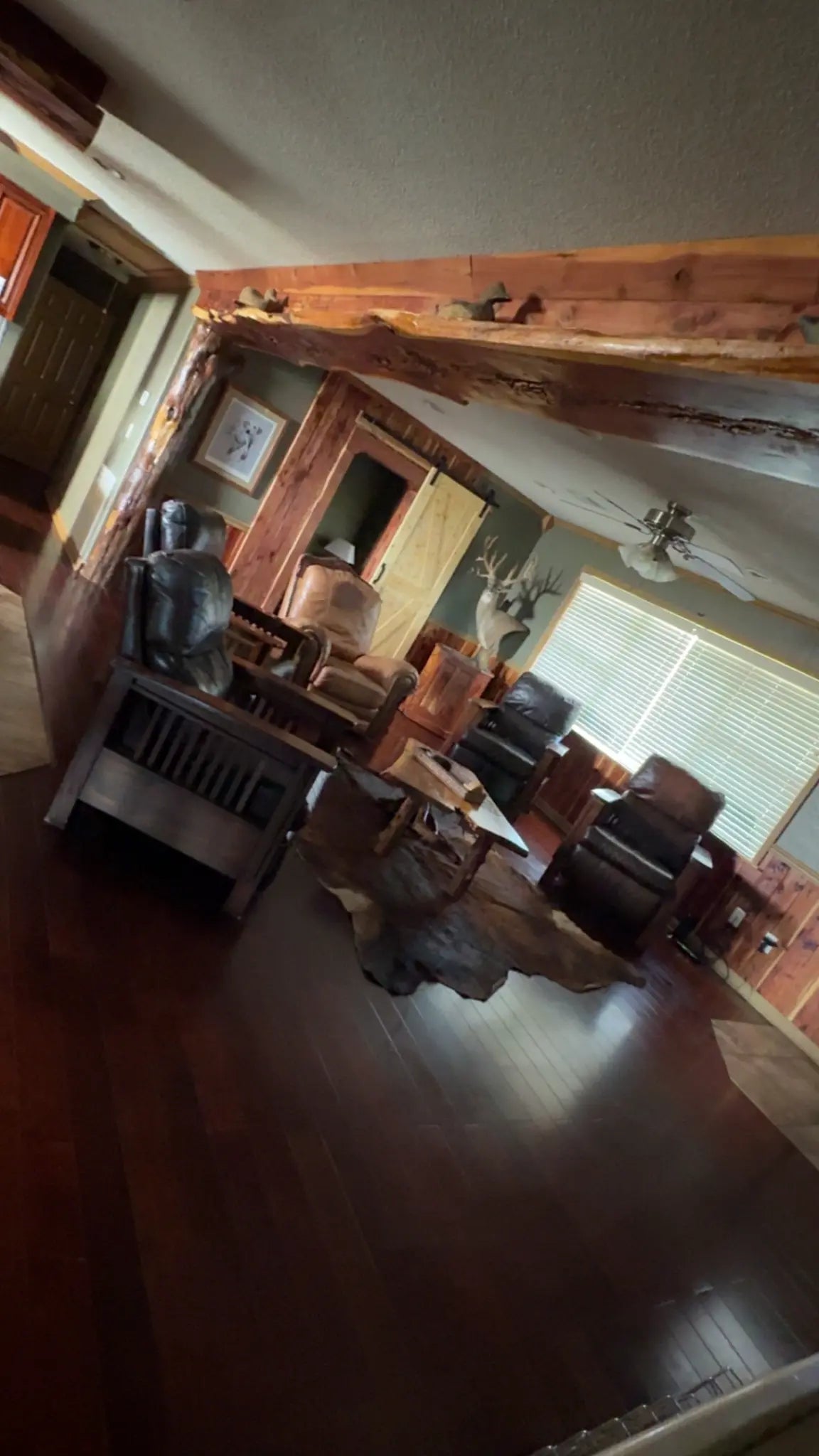 Rustic living room and seating inside The Mallard’s Nest lodge